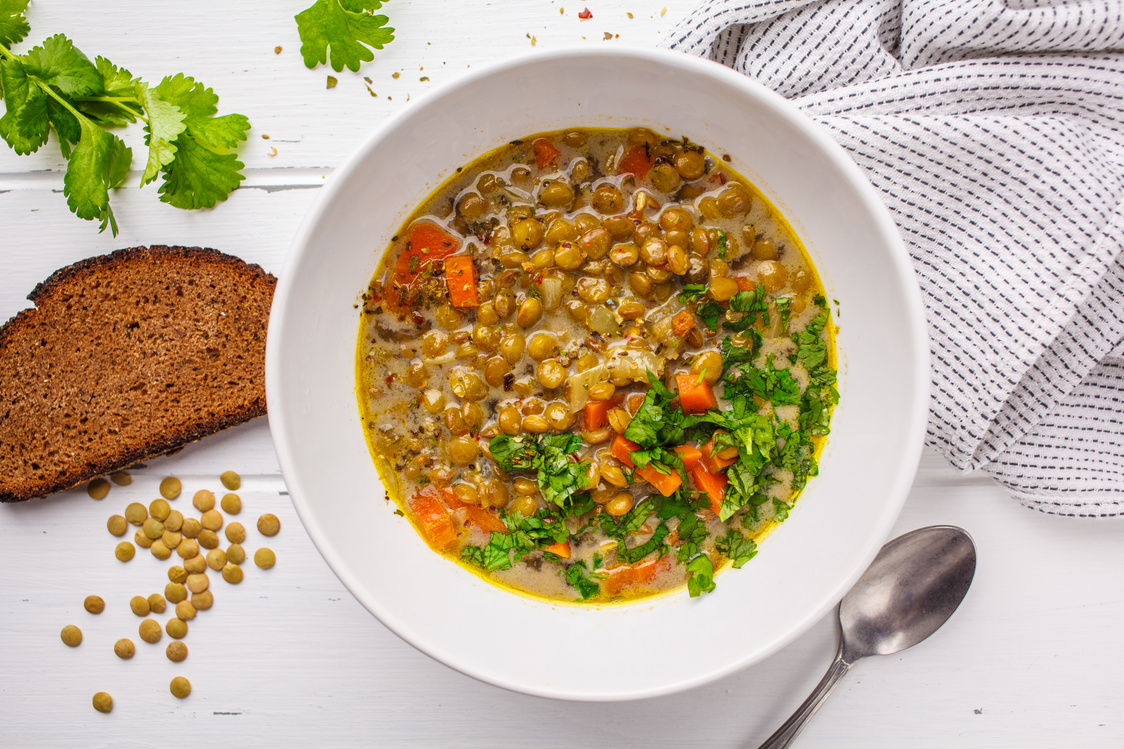 Homemade Vegan Lentil Soup with Vegetables, Bread and Cilantro,